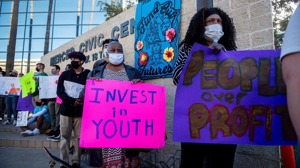 Youth and community members gather outside the Merced Civic Center during the Fund Our Futures rally in Merced, Calif., on Monday, Oct. 18, 2021. The rally was held to urge the City of Merced to invest $3 million of the $27 million of American Rescue Plan Act federal relief money, into youth jobs and direct income.