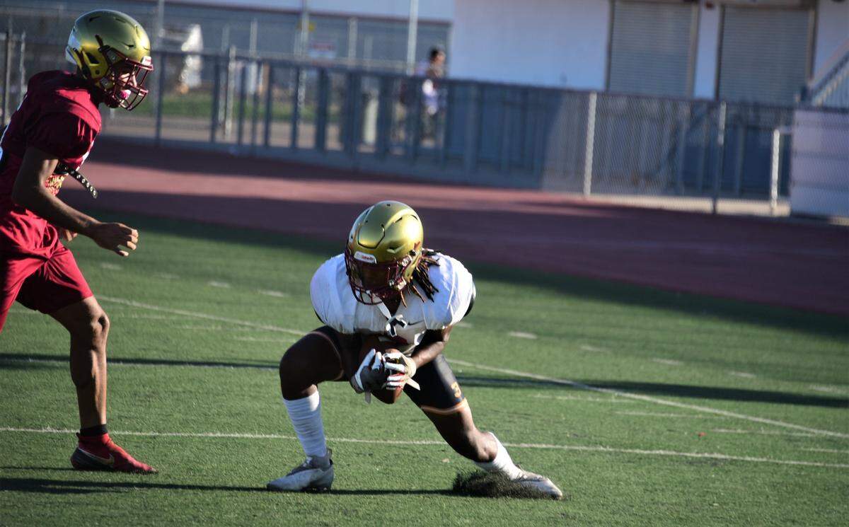 Golden Valley High School junior receiver Jonah White hauls in a pass during practice on Tuesday, Aug. 9, 2022 at Veterans Stadium in Merced, Calif.