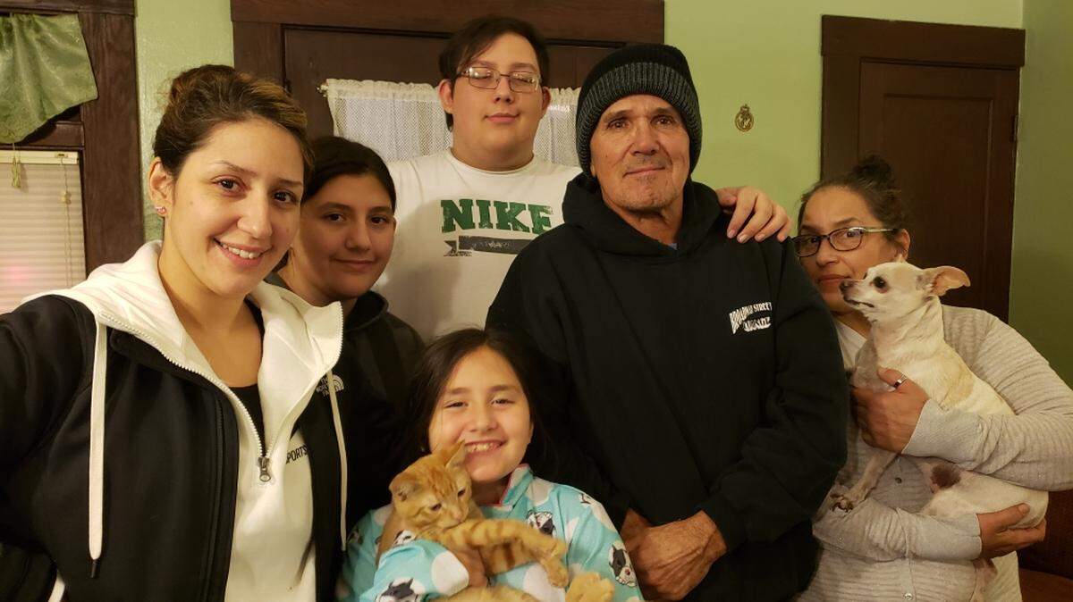 Pictured is Rickey Esquivel (center with black sweatshirt) and his family. The family lost their home when it was burned down during the Camp Fire in Paradise.