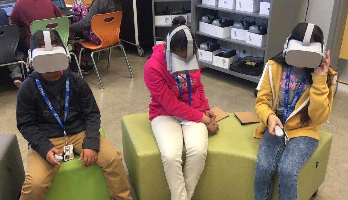 Merced City School District middle school students tour college campuses across the country using virtual reality headsets at the district’s STEAM Center.