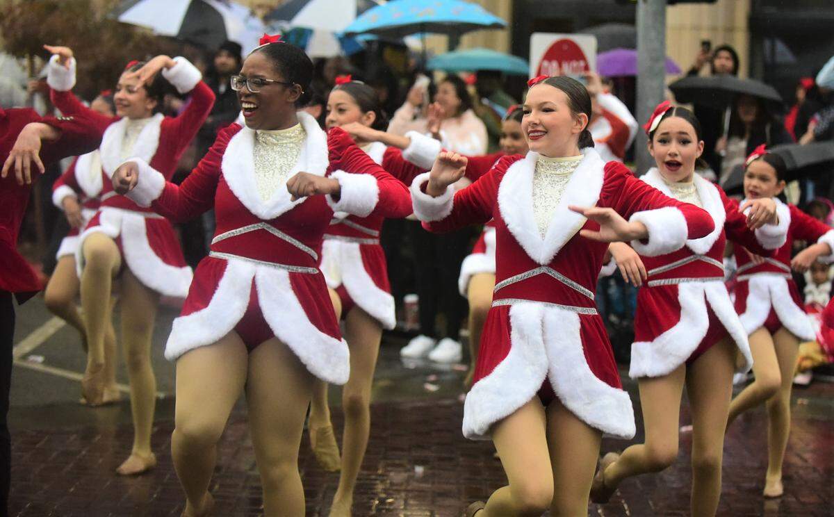Members of the Studio K dance studio perform in front of Bob Hart Square during the Merced Christmas Parade on Saturday, Dec. 3, 2022.
