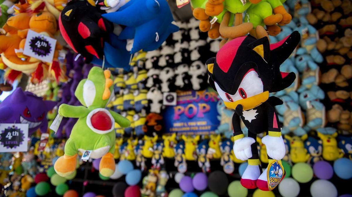Prizes hang from the roof of a carnival game at the Merced County Fair in 2024. 