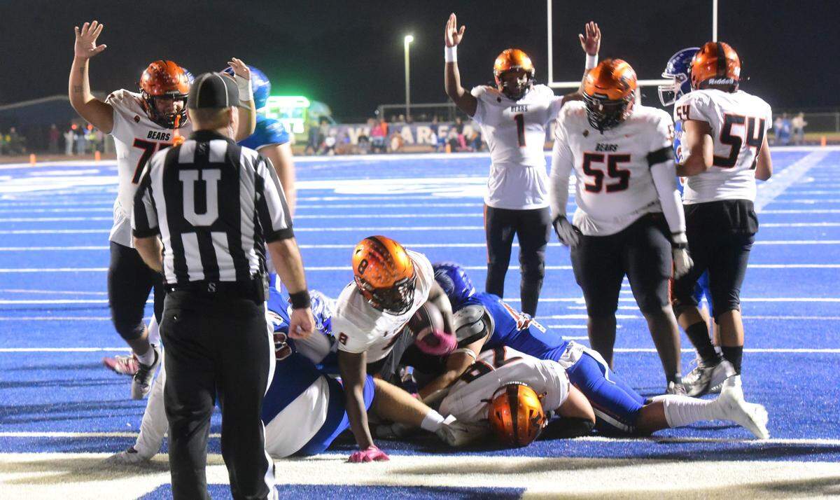 Merced High running back Cammarri Jackson plunges into the end zone while his teammates signal for the touchdown during the Santa Fe Bowl 44 against Atwater on Friday, Oct. 26, 2024 at Dave Honey Stadium.