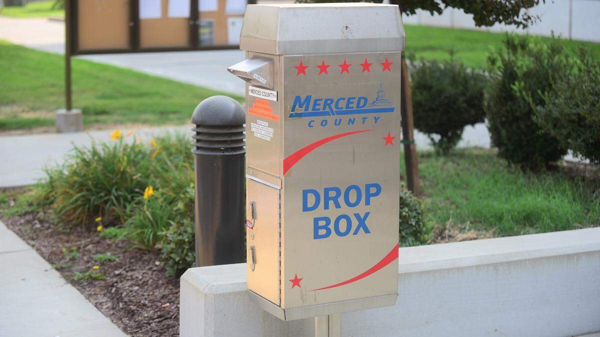 The Merced County Registrar Office is asking voters if they are dropping off their mail ballots to make sure they dropping them off at offical drop boxes like this one posted outside the Administration Building on M Street in Merced, Calif.