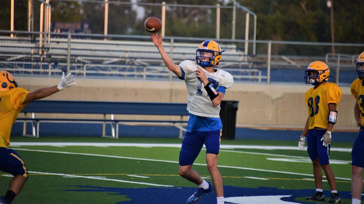 Dos Palos High School junior Peyton Van Worth throws a pass during practice on Tuesday, Aug. 16, 2022.