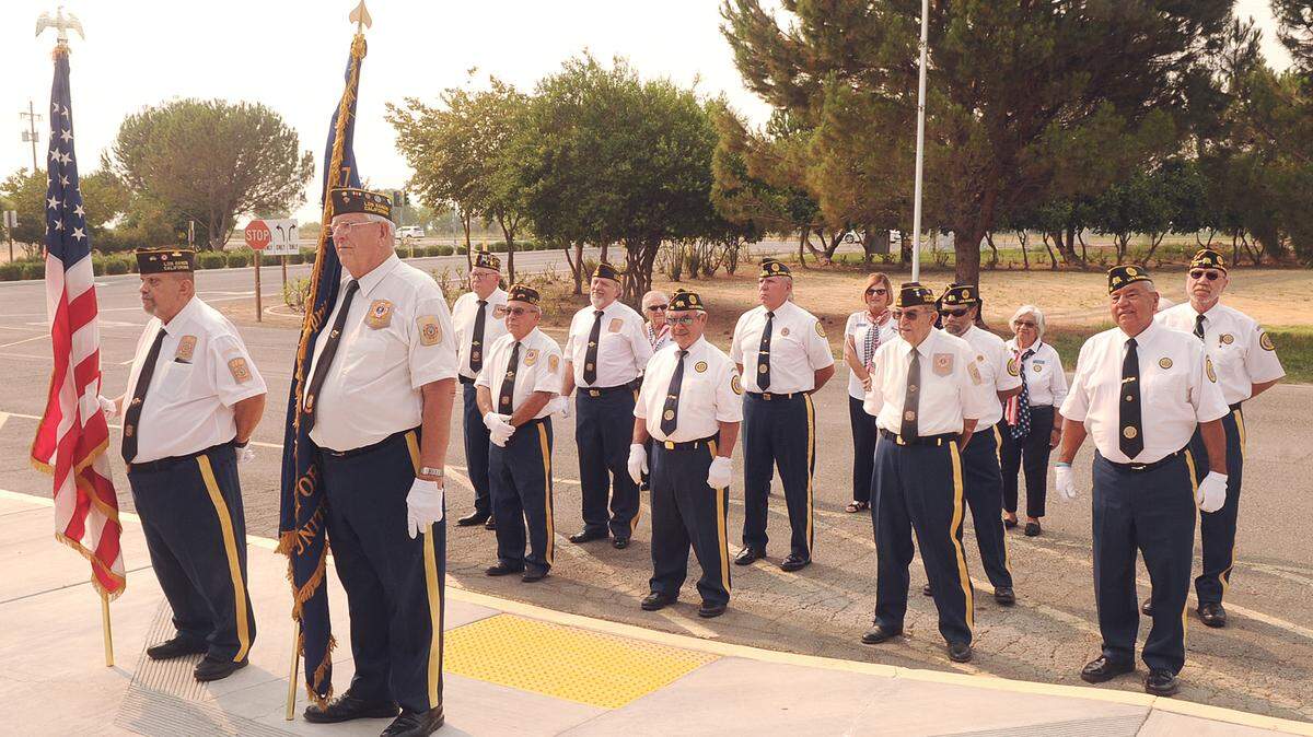 Members of the Los Banos VFW Post 2487 and Los Banos American Legion Post 166 post the colors during the Joe Cox Memorial Highway sign dedication ceremony Sat., Aug. 7, 2021 at Merced College Los Banos Campus.
