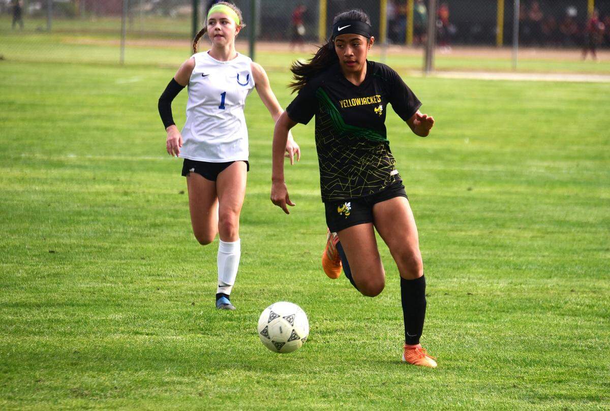 Hilmar High school sophomore Alyssa Colston attempts to make a run against University Prep during the Northern California Regional Division V semifinal match on Thursday, Feb. 29, 2024 at Hilmar High School.