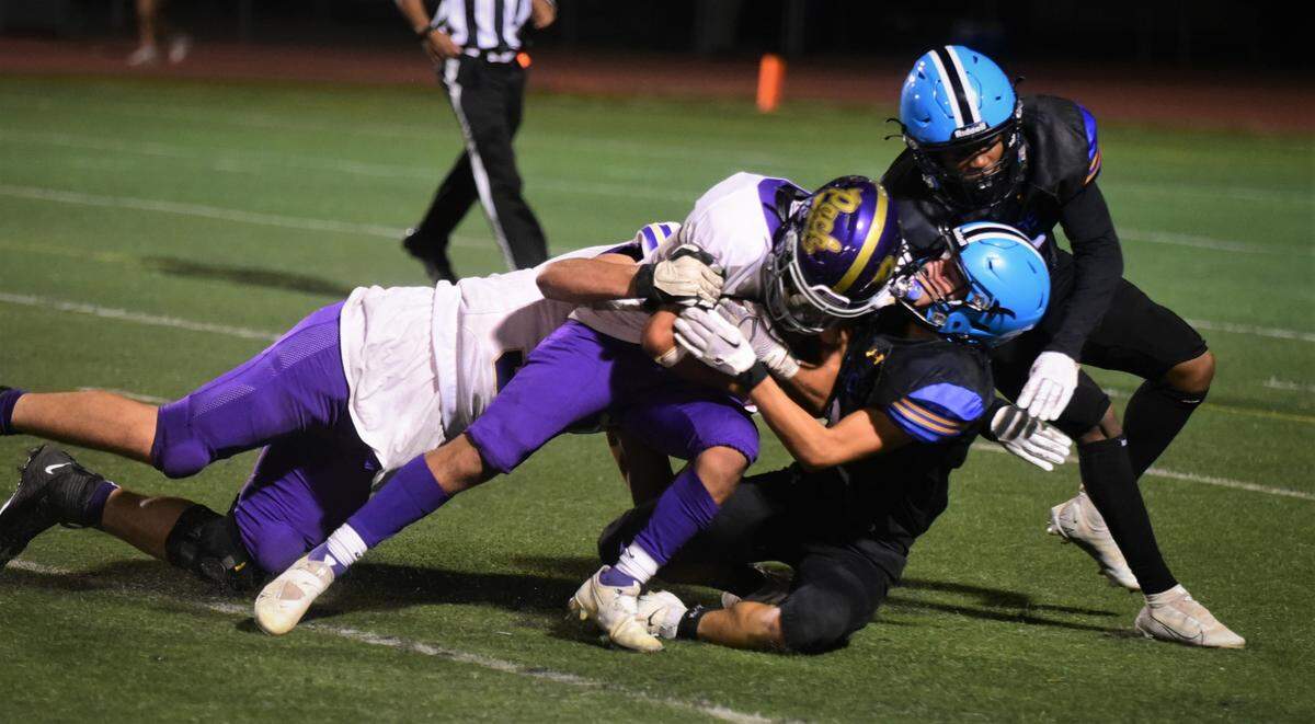 Livingston High School’s Jordan Alvarez runs for some tough yards against El Capitan on Friday, Sept. 9, 2022 at Veterans Stadium in Merced Calif.
