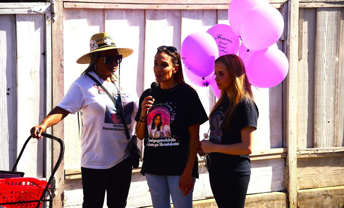 Victoria Hogue, middle, speaks to the crowd about her daughter Tatyanna, who was killed nearly three years ago, during the 14th annual Riley Brothers Victims Remembrance Walk on Saturday, Oct. 14, 2023.
