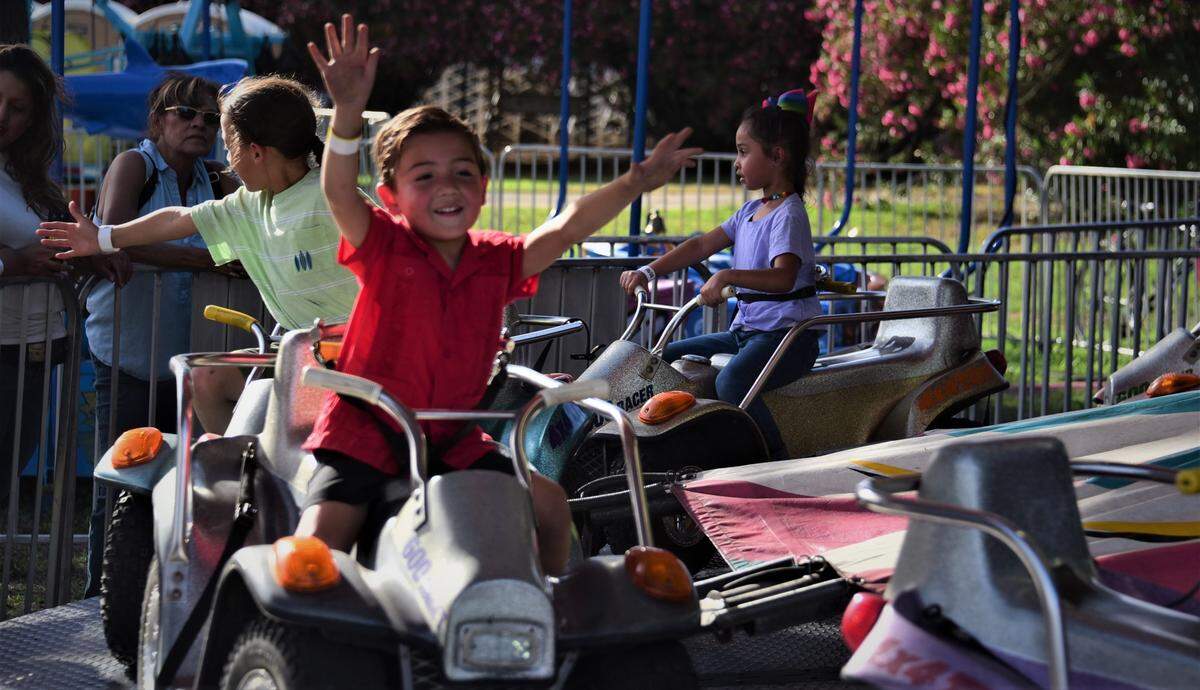 Gabriel Garcia, 4, of Planada rides one of the rides for kids at the Merced County Fair on Wednesday, June 8, 2022.