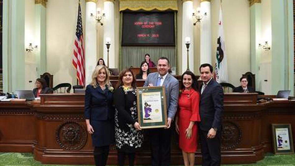 Assemblyman Adam Gray (center) center presents Winton’s Mireya Aguilar (second from left) with the 21st Assembly District Woman of the Year award at the State Capitol earlier this week.