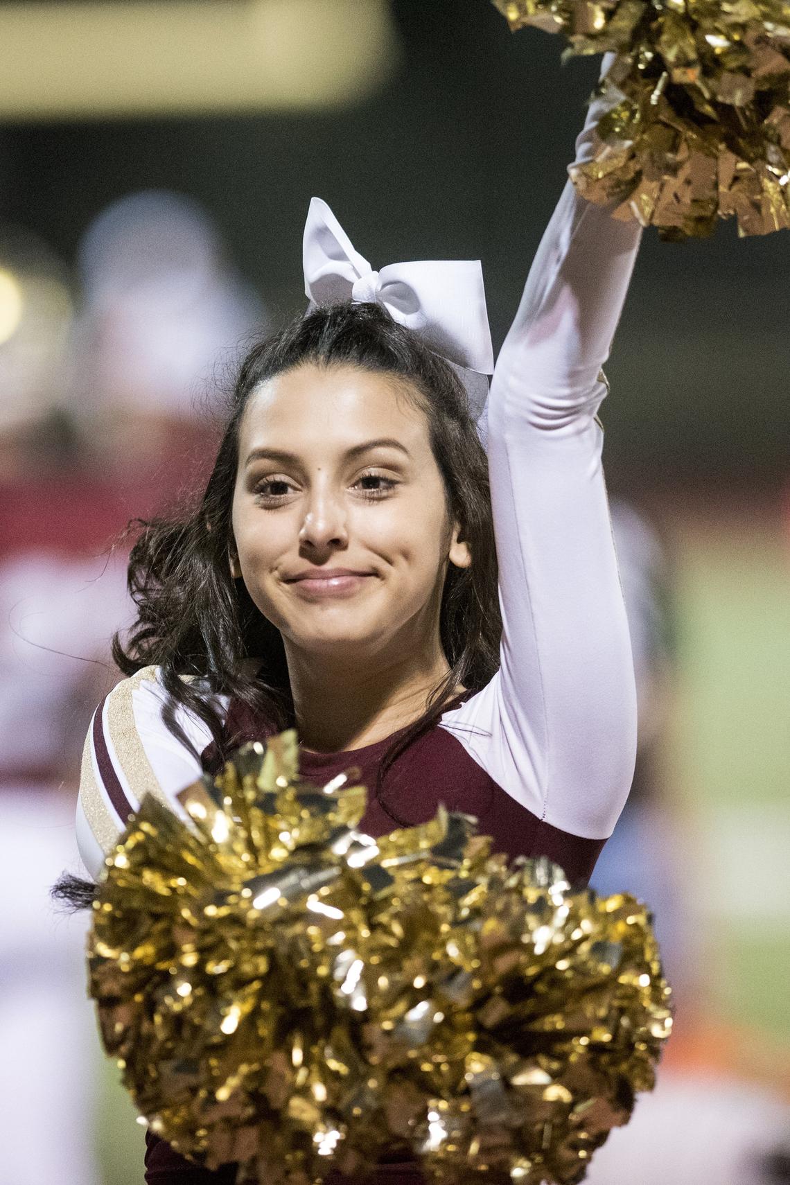 Golden Valley freshman cheerleader Serena Lopez cheers on the Cougars during a game against Cordova in the CIF Sac-Joaquin Section Playoffs at Golden Valley High School in Merced, Calif., on Friday, Nov. 2, 2018.