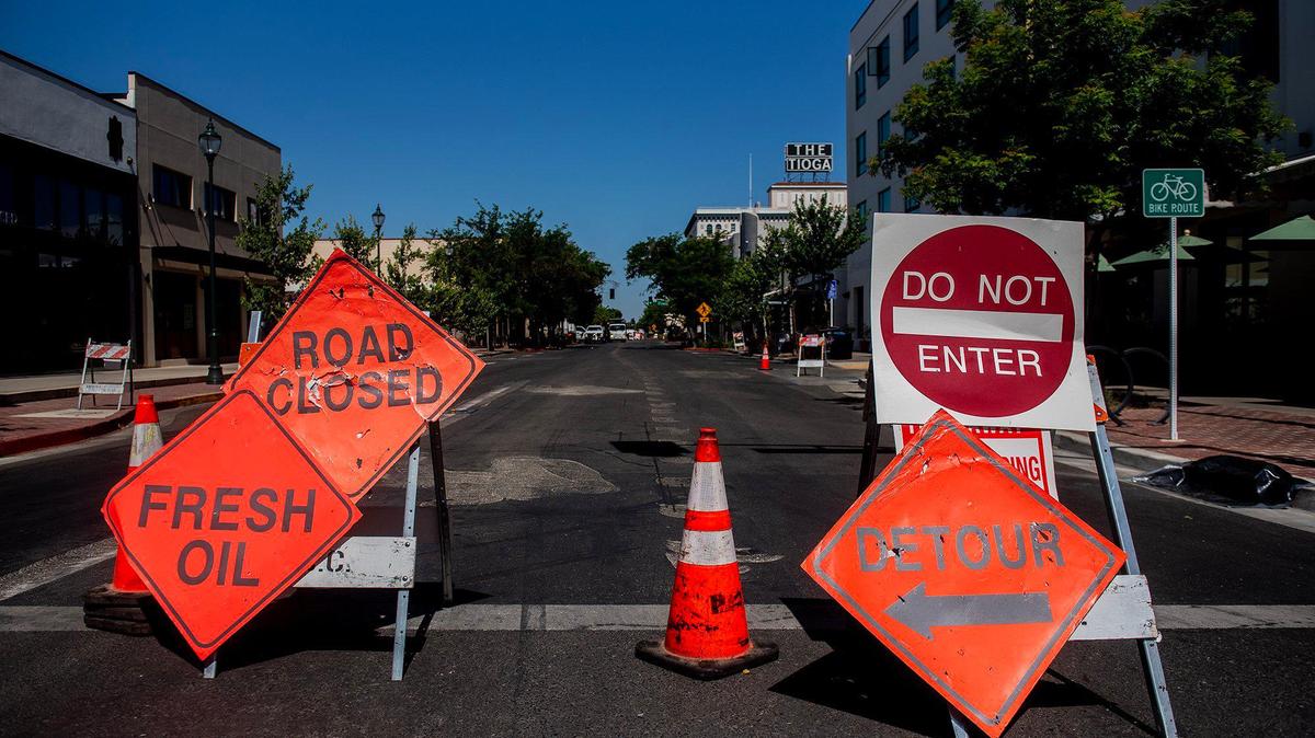 A section of West Main Street is closed between M Street and N Street as crews work to prepare streets for sealing, striping and one-way traffic in Merced, Calif., on Wednesday, May 28, 2025.