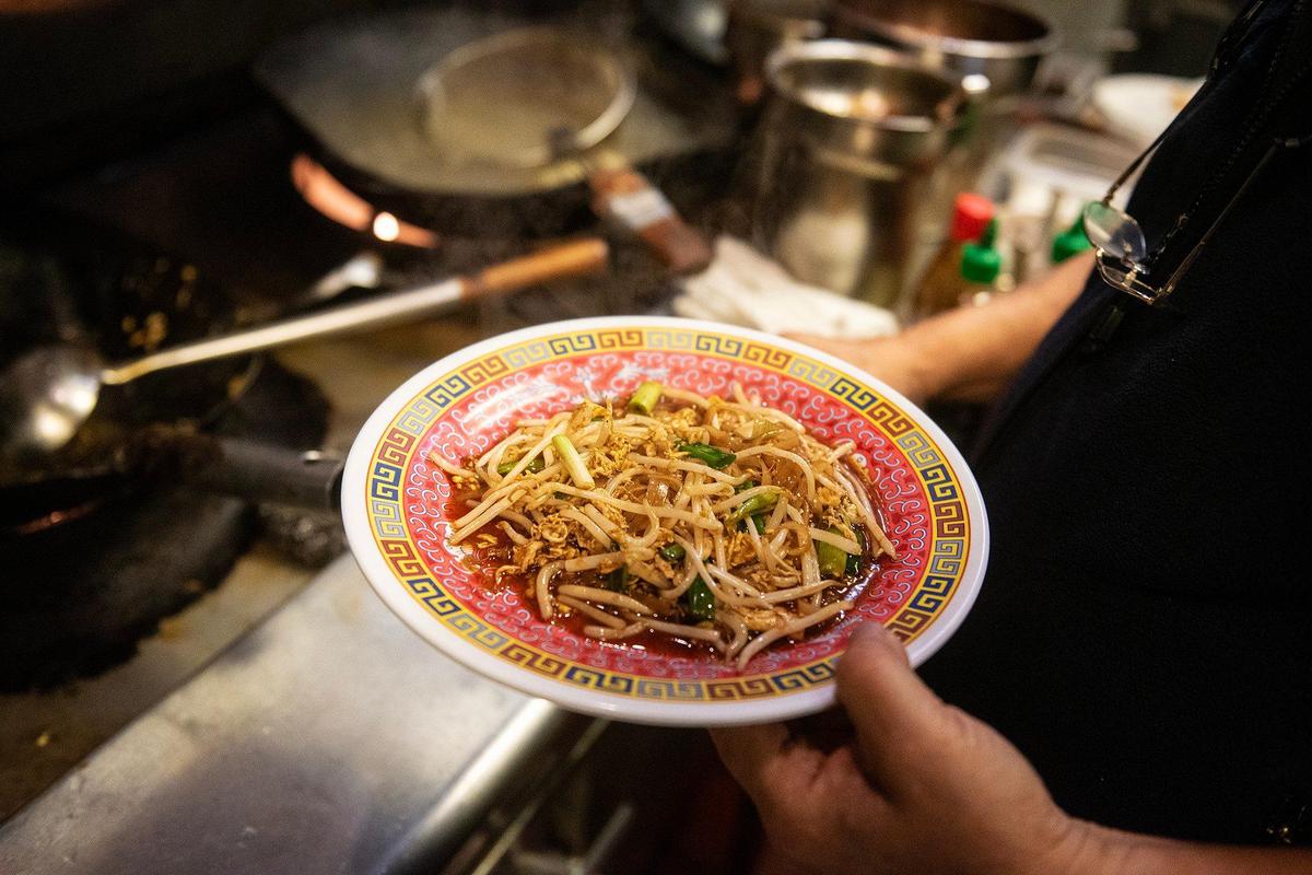 Sam Malaythong, 76, owner of Sam Cafe, demonstrates how he makes pad thai at his restraurant located at 235 W. 12th Street Suite B, in Merced, Calif., on Friday, Jan. 31, 2025.