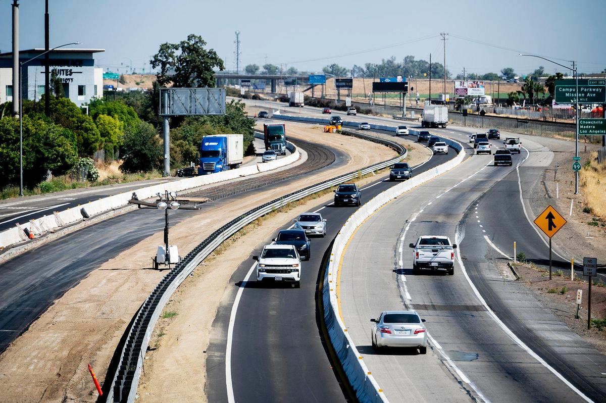 Traffic flows along a split section of Highway 99 under construction in Merced, Calif., on Wednesday, May 18, 2022.