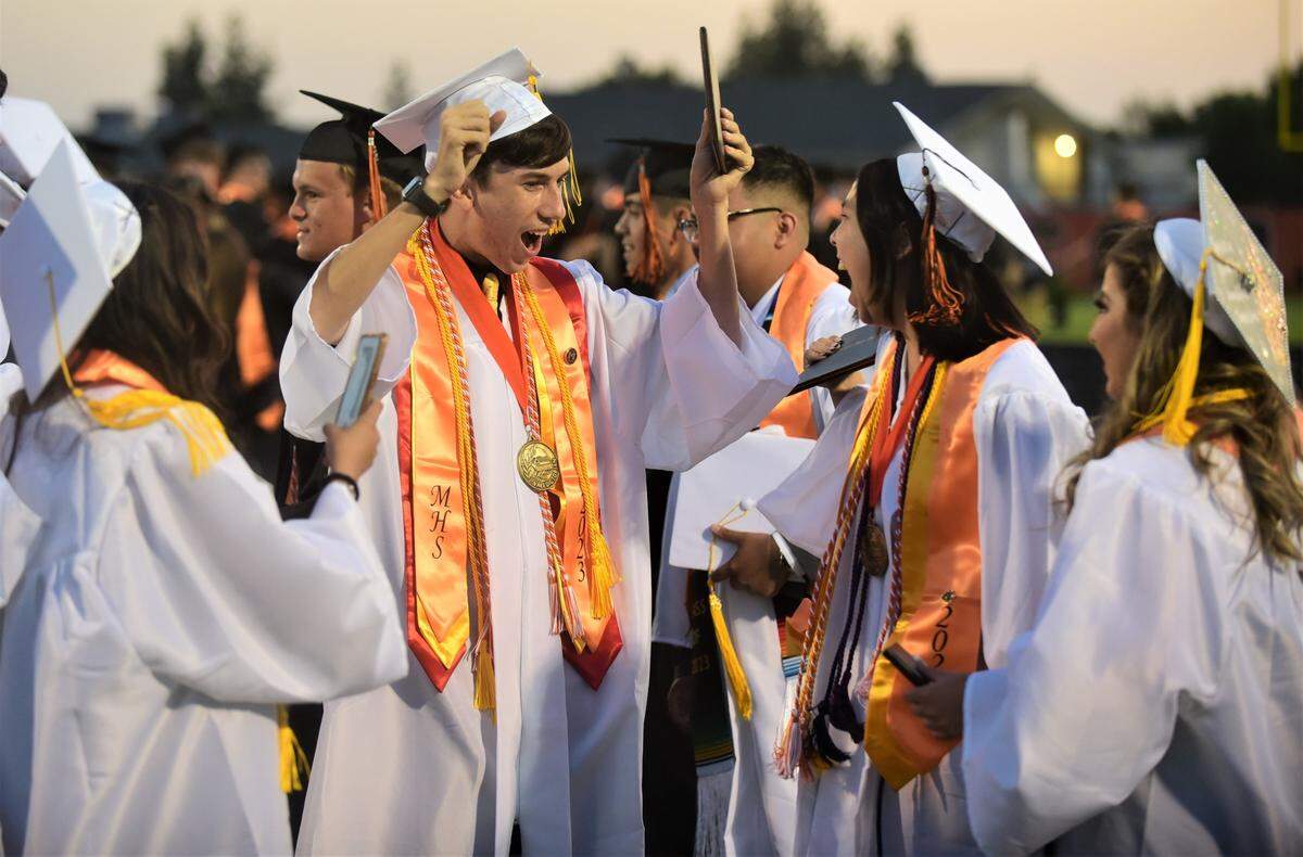 Merced High School graduates celebrate after the school’s graduation ceremony on Thursday, June 1, 2023.