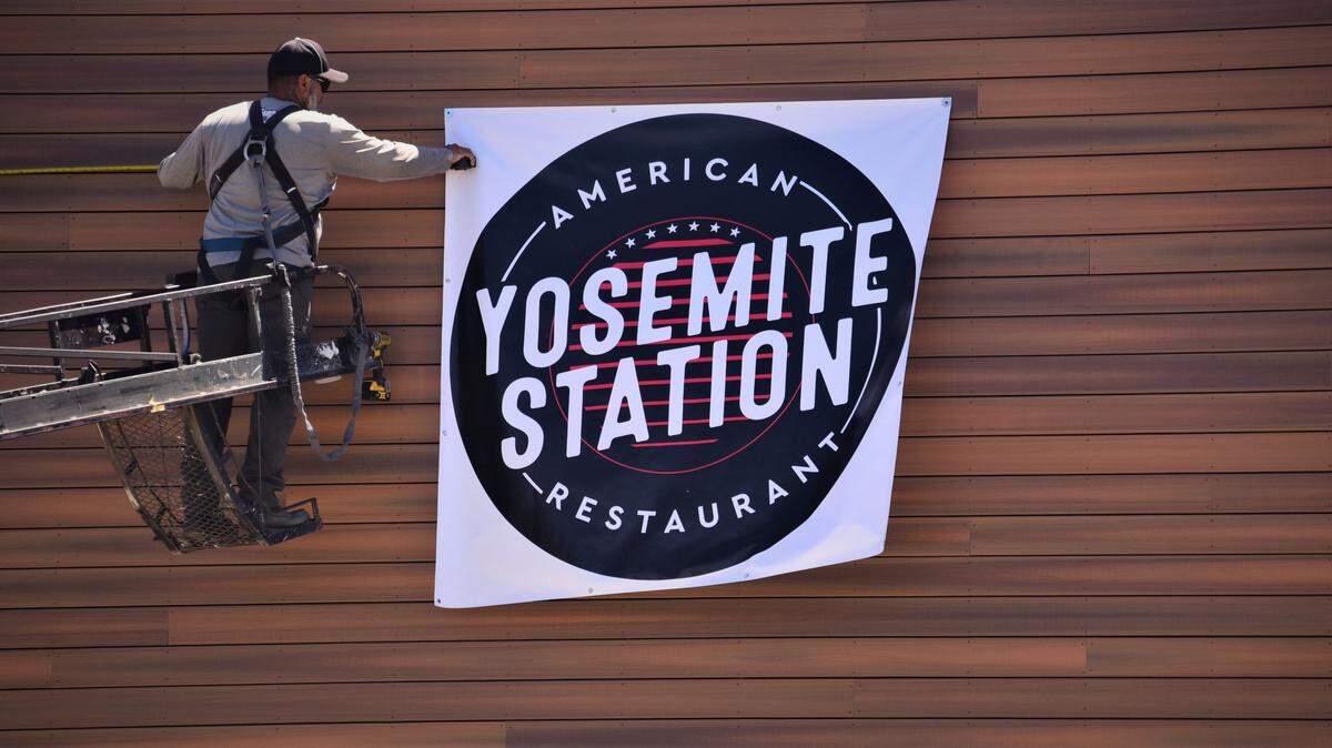 After 34 years, Paul’s Place is moving to the Yosemite Crossing shopping center in north Merced and will change it’s name to Yosemite Station. A temporary sign is hung at the new location on Thursday, July 27, 2023.