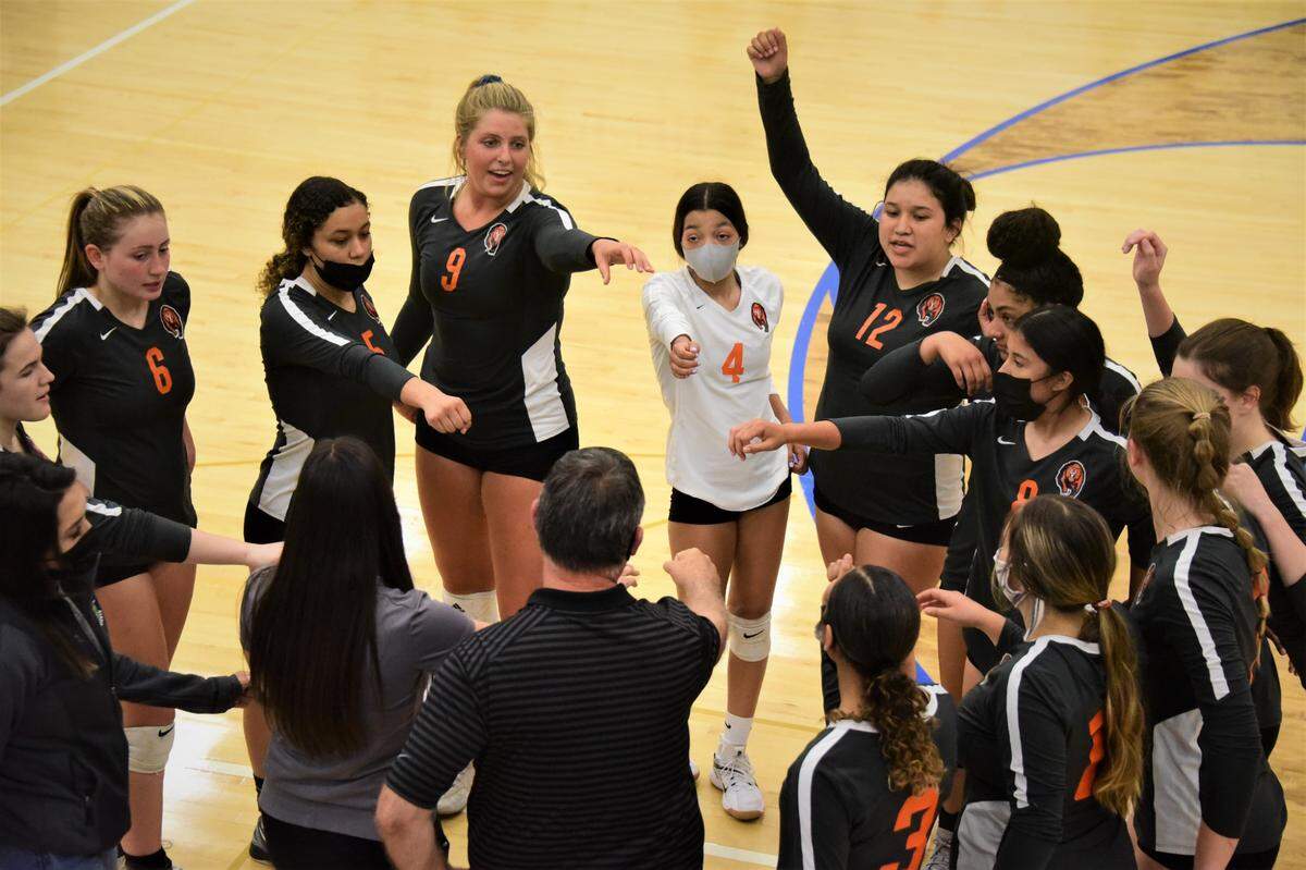 The Merced High girls volleyball team talks during a timeout during a match against Atwater on Wednesday, May 26, 2021.