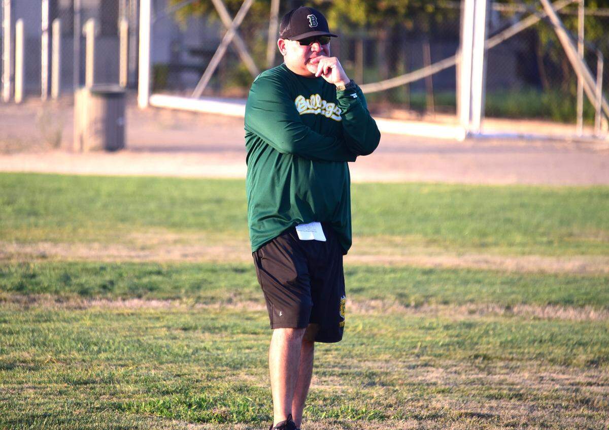 Le Grand High School football coach Aaron Martinez watches defensive drills during practice on Thursday, Aug. 8, 2024.
