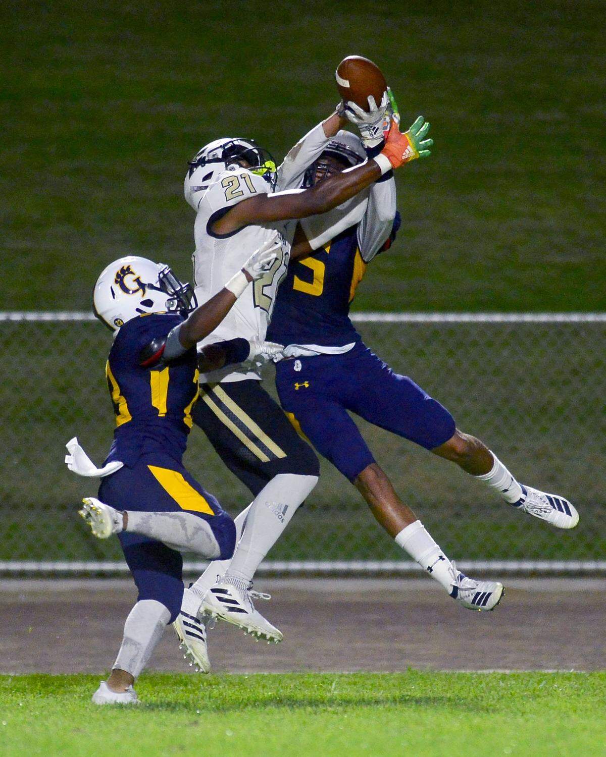 Buhach Colony receiver Trey Paster (21) fights for the ball against Gregori defender Trevien Mclendon (5) during a game between Gregori and Buhach Colony at Gregori High School in Modesto California on August 23, 2019.