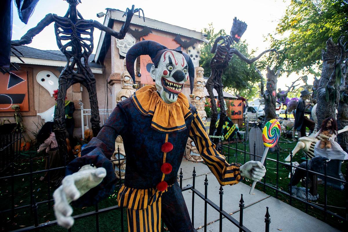 Halloween decorations fill the yard of Miguel Avila, 28, at his home on West 9th Street in Merced, Calif., on Thursday, Oct. 17, 2024.
