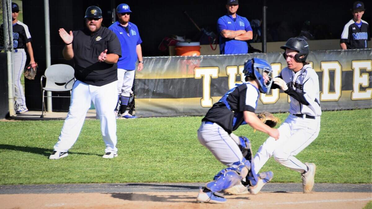 Buhach Colony’s Kadyn Fillebrown scores as Thunder coach Joe Medeiros looks on during a 3-1 playoff win over Mountain House on Tuesday, May 10, 2022 at Buhach Colony High School in Atwater, Calif.