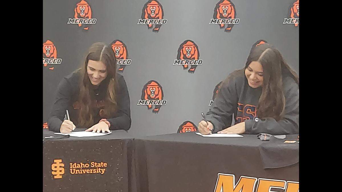 Merced High softball players Ava Brown (left) and Trisha McCleskey sign their national letters of intent to accept scholarships during a ceremony at Merced High School on Wednesday, Nov. 10, 2021.