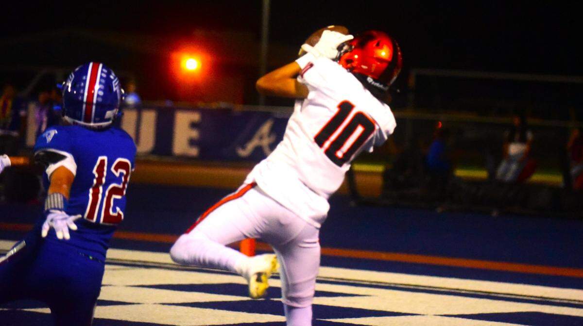 Merced High School receiver Antonio Aaron (10) hauls in a touchdown pass during the Bears’ 48-14 win over the Falcons in Santa Fe Bowl 53 on Friday, Sept. 22, 2023 at Dave Honey Stadium in Atwater, Calif.