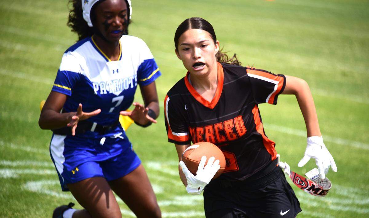 Merced High senior Leah Perez runs the ball during a flag football game on Saturday, Aug. 24, 2024 at Merced High School.