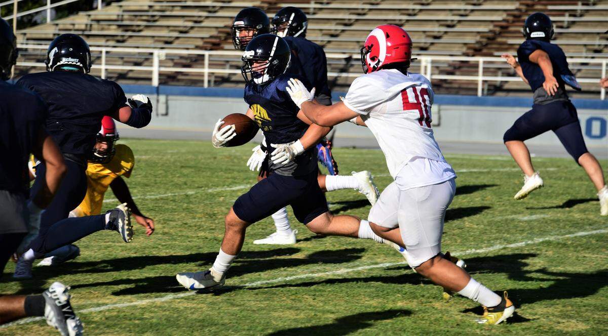 Merced College linebacker Xavier Avila returns an interception during a scrimmage against Fresno City at Stadium ’76 on Thursday, Aug. 25, 2022.