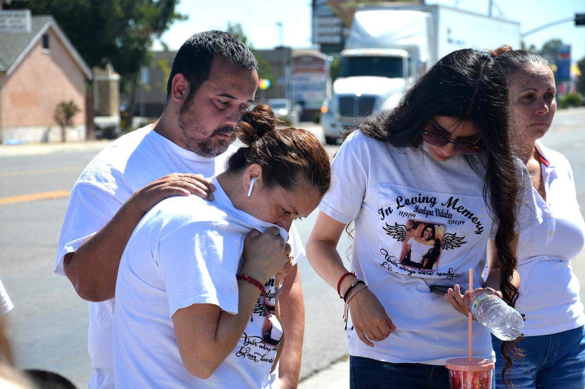 Madera 19-year-old Marlyne Vidales’ family gathers around a flower memorial they made after a July 31, 2019, court hearing on Ivan Andrade, a Los Banos man who is accused of driving 150 mph before he collided into a car on March 10, 2019, killing Vidales and severely injuring four others. Vidales’ family sets flowers at the spot Vidales was killed, the corner of 10th Street and Pacheco Boulevard in Los Banos, after every court hearing.