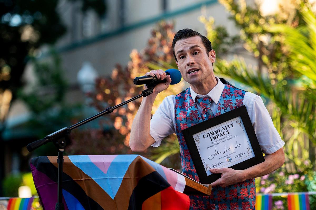 Adam Lane of Merced, speaks after receiving a Community Impact award from the Merced Pride Center, during the Pride Progress flag raising ceremony at Bob Hart Square in Merced, Calif., on Wednesday, June 1, 2022. The Merced City Council approved the addition of the Pride flag to the regular flag calendar, meaning the flag will fly over Bob Hart Square annually during the month of June.