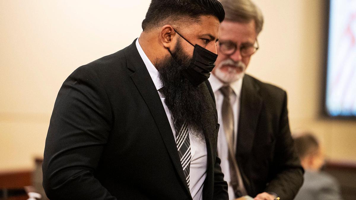 Livingston police Sgt. Wapinder Kang turns toward the courtroom seating after appearing before Merced Superior Court Judge Steven Slocum, during an arraignment hearing in Merced, Calif., on Tuesday, Aug. 31, 2021. Kang has been charged with filing a false report.