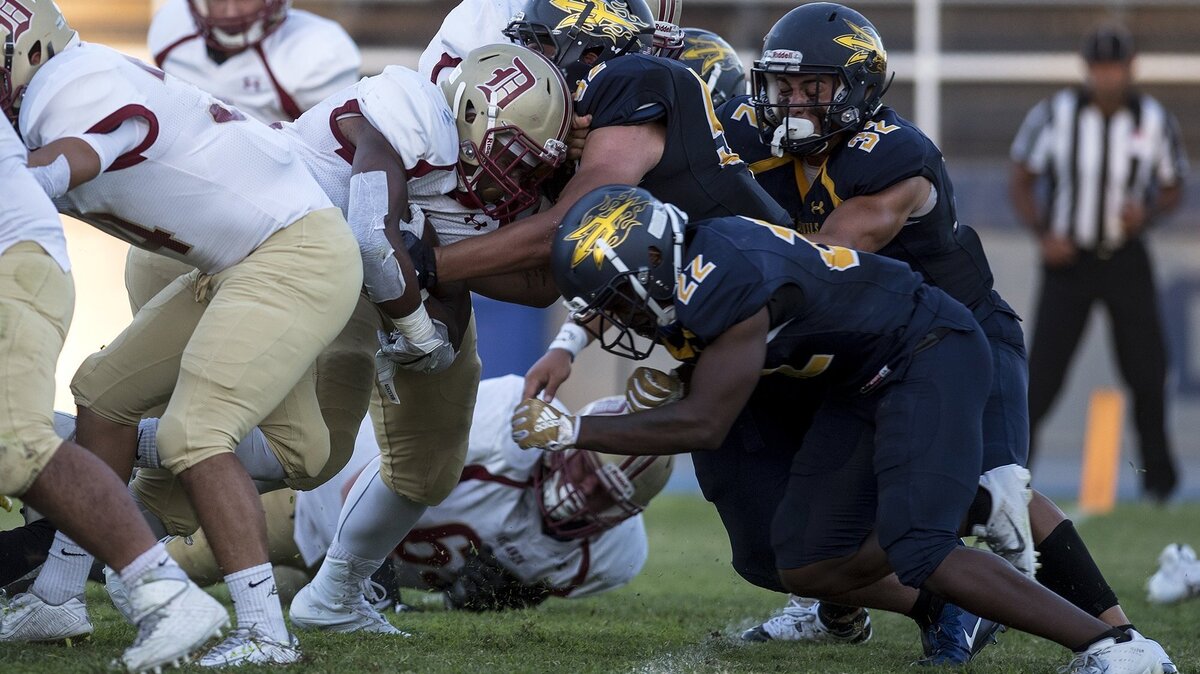 The Merced College defense stops De Anza at the goal line on a fourth down play during a game at Stadium ’76 in Merced, Calif., on Saturday, Sept. 8, 2018. De Anza beat the Blue Devils 29-27.
