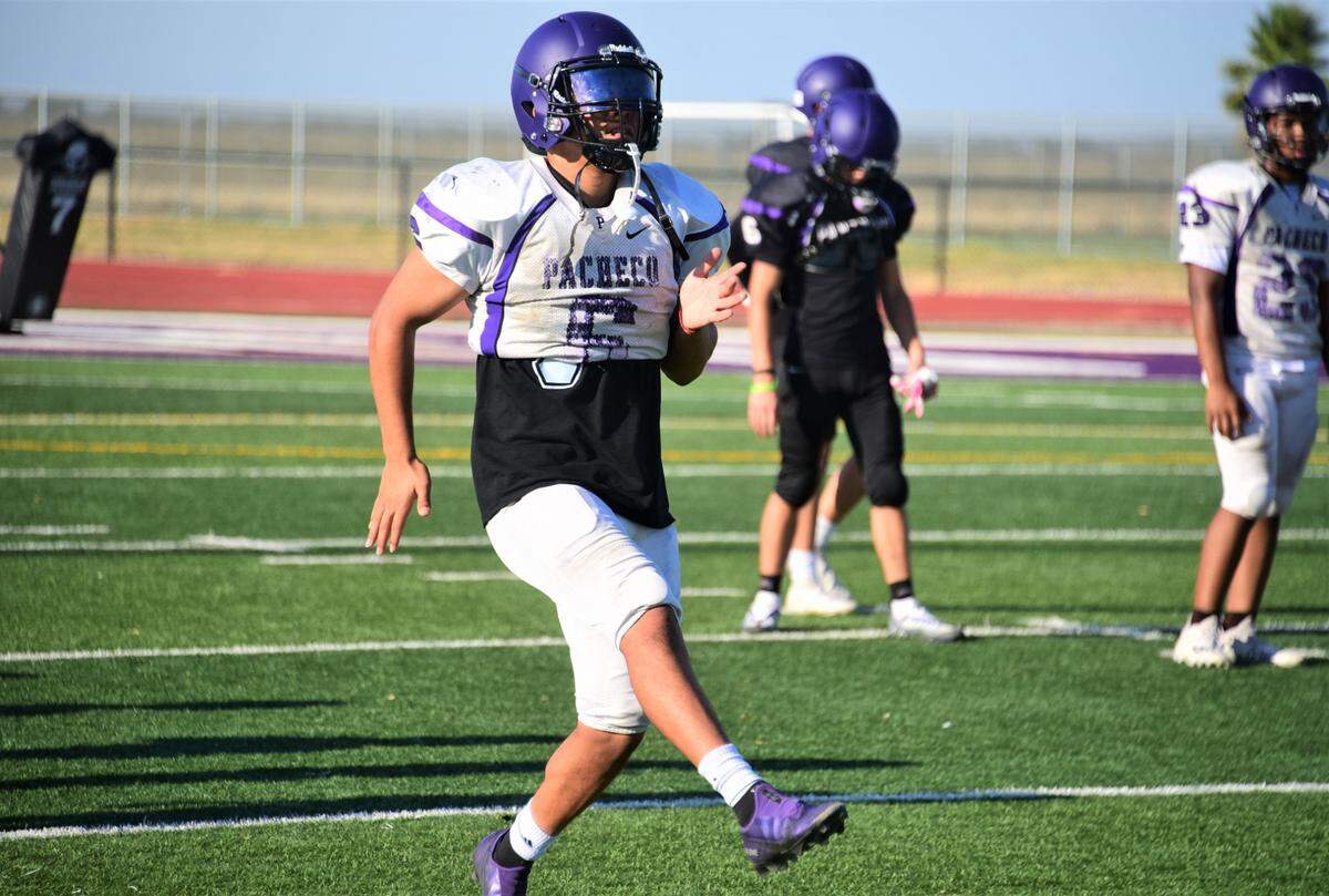 Pacheco High School junior linebacker Abel Bravo warms up during practice on Wednesday, Aug. 3, 2022 at Pacheco High School in Los Banos, Calif.