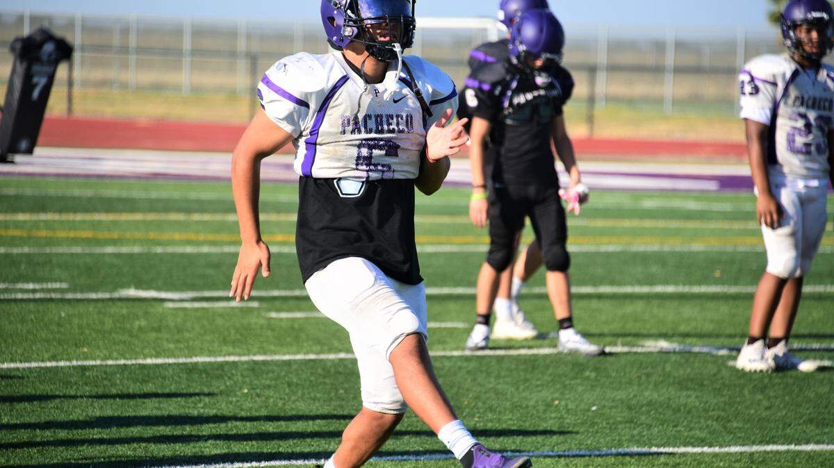 Pacheco High School junior linebacker Abel Bravo warms up during practice on Wednesday, Aug. 3, 2022 at Pacheco High School in Los Banos, Calif.