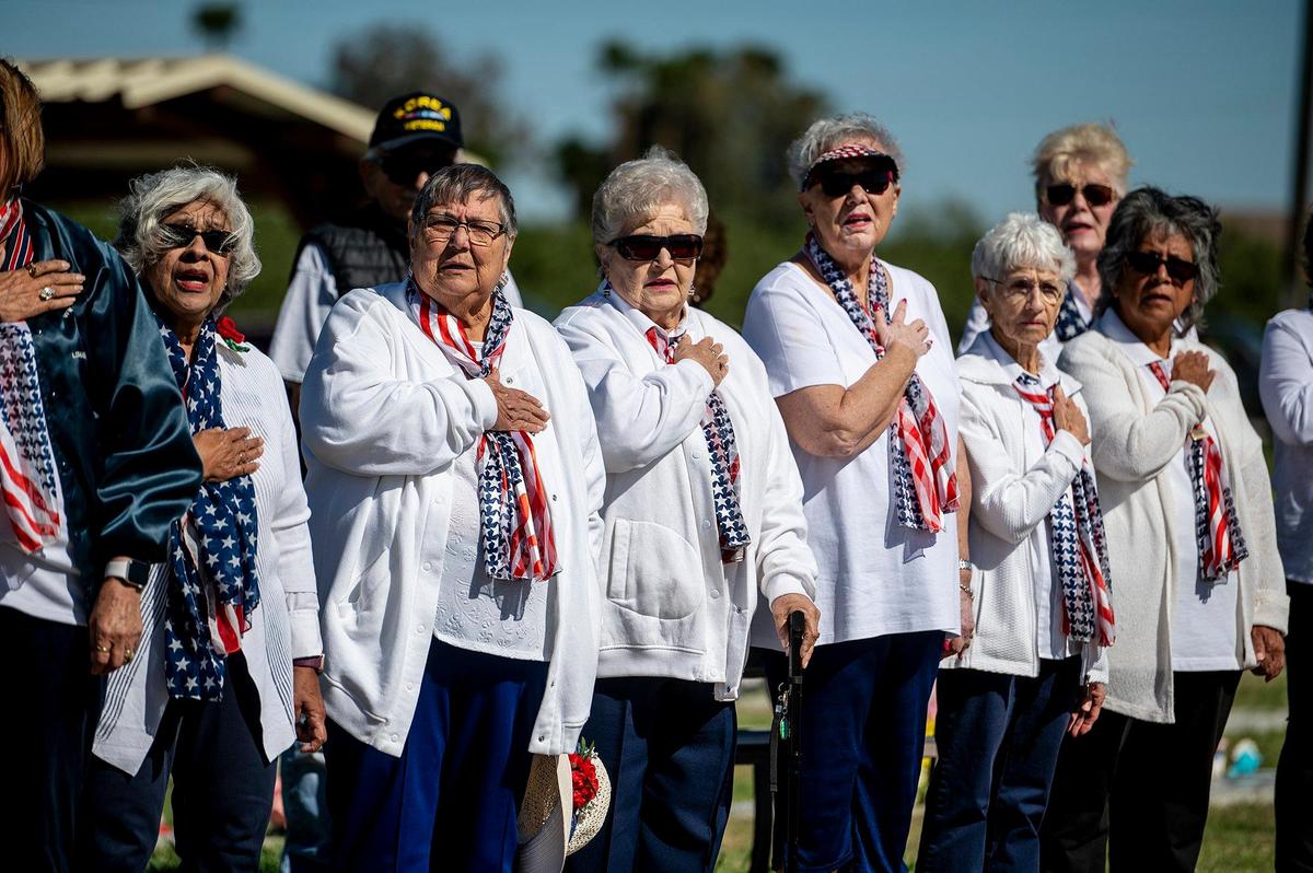 People recite the Pledge of Allegiance during a Memorial Day ceremony at the Los Banos Cemetery, located at 16575 Center Avenue in Los Banos, Calif., on Monday, May 30, 2022.
