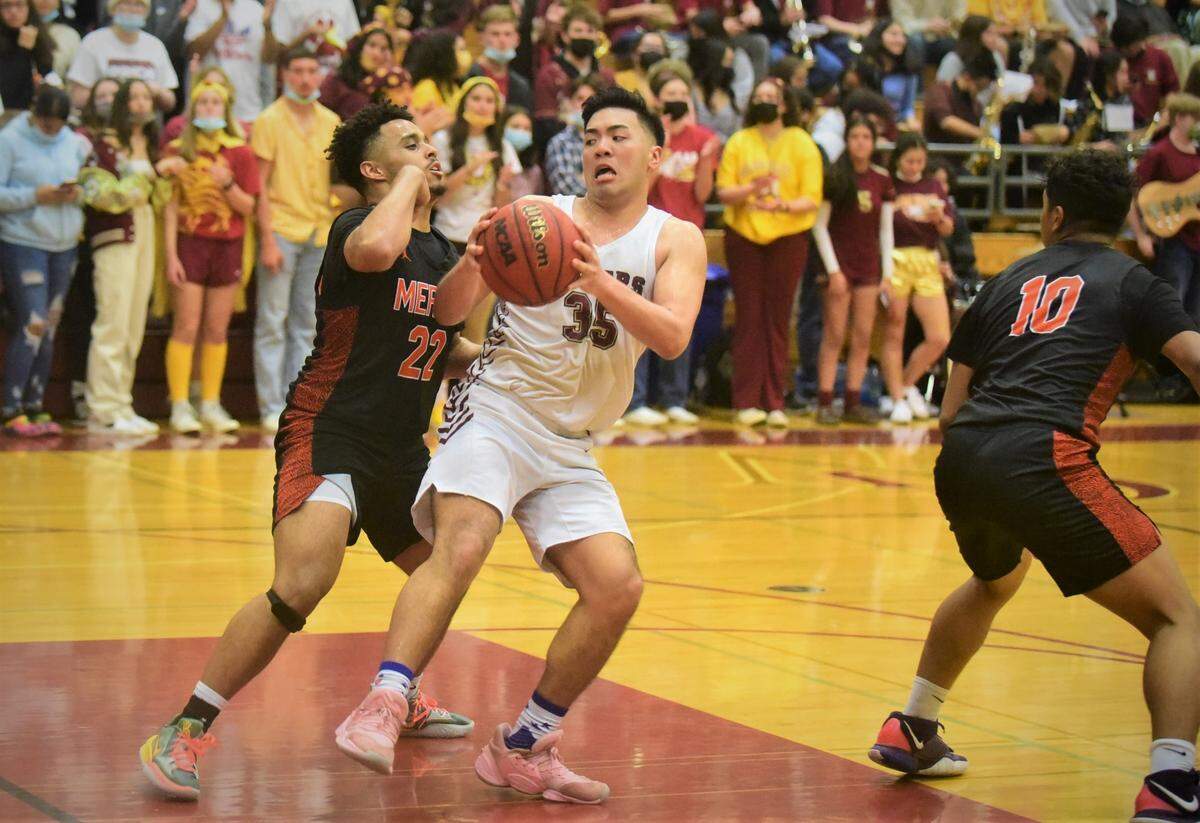 Golden Valley senior Mateo Tangaan tries to work against Merced senior Seth Mays-Meneley during a game at Cougar Arena on Friday, Feb. 11, 2022.