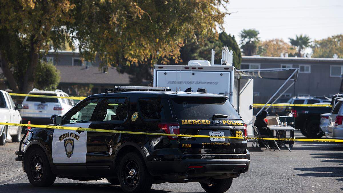 The Merced Police Department investigates a shooting that killed one person and injured two others at an apartment complex near the northeast corner of Glen Avenue and East Santa Fe Avenue in Merced, Calif., on Wednesday, Dec. 2, 2020.