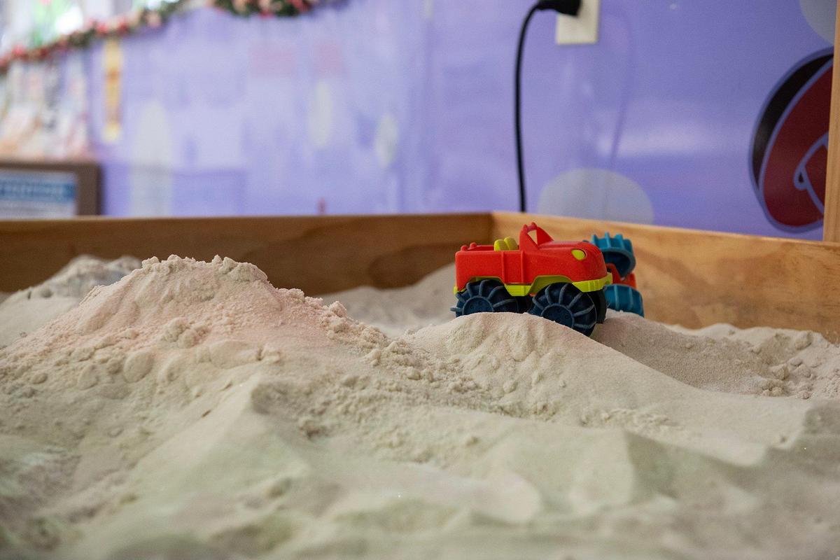 A sandbox with toy vehicles at the Kids Discovery Station located at 350 W. Yosemite Ave. in Merced, Calif., on Wednesday, March 12, 2025.