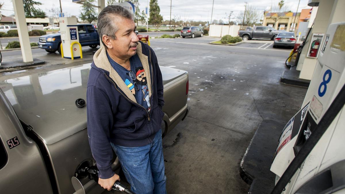 Derrick Gonzales of Merced, fills his tank at the Arco gas station located at 3100 G Street in Merced Calif., on Thursday, Feb. 16, 2017. According to GasBuddy, the average price of gas in Merced is 42.1 cents lower than last week heading into the upcoming Thanksgiving weekend.