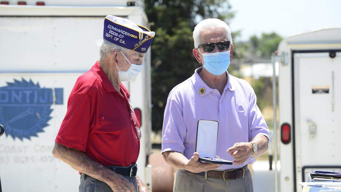 Rep. Jim Costa, right, is shown honoring Merced resident and Korean War veteran Earl Thomas on Friday, July 17, 2020, in Merced County, Calif.