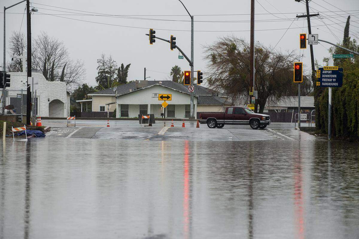 A section of Childs Avenue between G Street and Highway 59 is closed due to flooding in Merced, Calif., on Monday, Jan. 9, 2023.