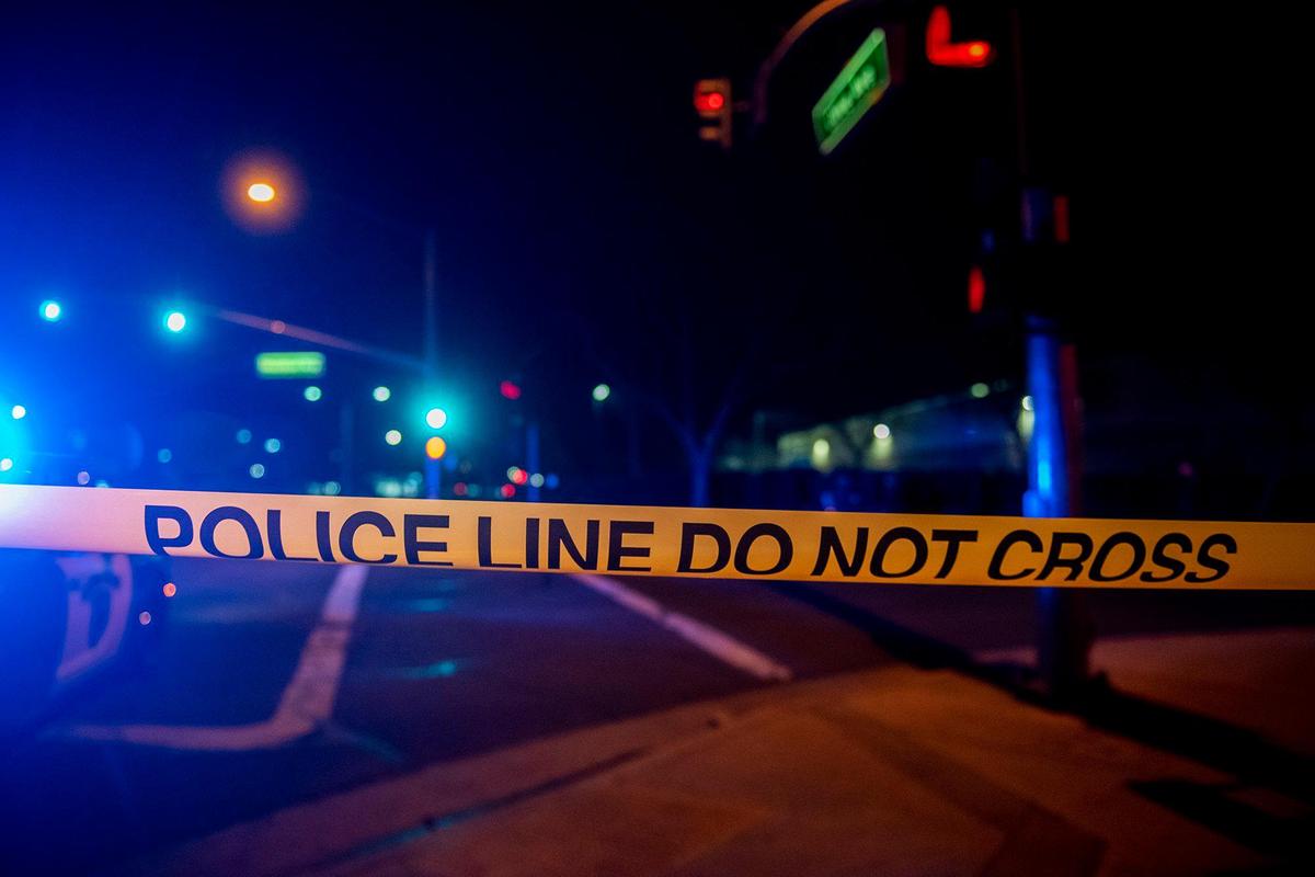Merced police investigate the scene of shooting near the intersection of Olive Avenue and Meadows Avenue in Merced, Calif., on Tuesday, Feb. 8, 2022. According to police, an adult male gunshot victim suffering from at least one gunshot wound was located in the 600 block of Loughborough Drive. He was transported to a hospital for treatment of serious injuries.