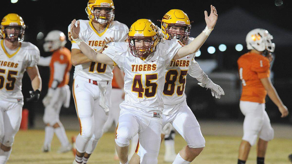 Los Banos kicker, Will Gilardi celebrates after his extra point attempt hit one side of the goal post, but made it through the uprights for the extra point following one of three Landon Ramos touchdowns Friday night, Nov. 8, 2019 in Woodland. Los Banos won the game 48-21 and advances to the next round of playoffs Fri., Nov. 15 against number four seed, Bradshaw Christian in Elk Grove.