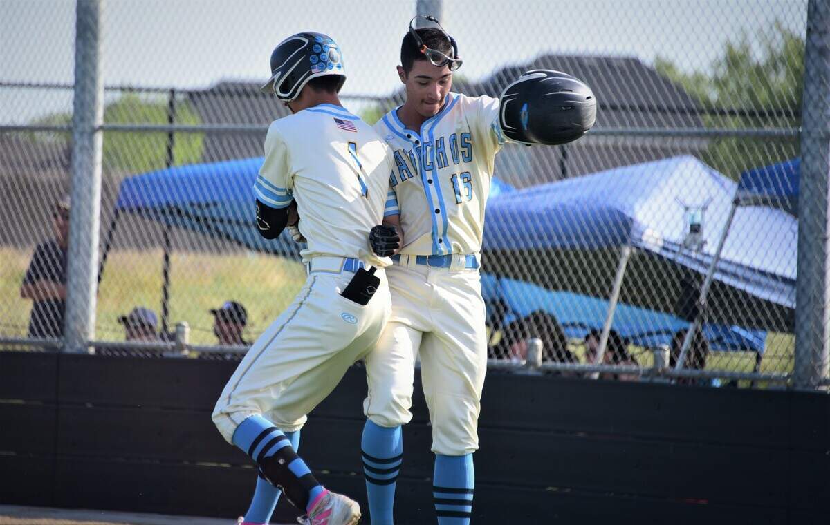 El Capitan High sophomore Juan Munoz (right) celebrates after scoring a run in the third inning by jumping up in the air with teammate Jacob Reyes during a 6-2 win over Buhach Colony on Friday, April 8, 2022 at El Capitan High School in Merced, Calif.