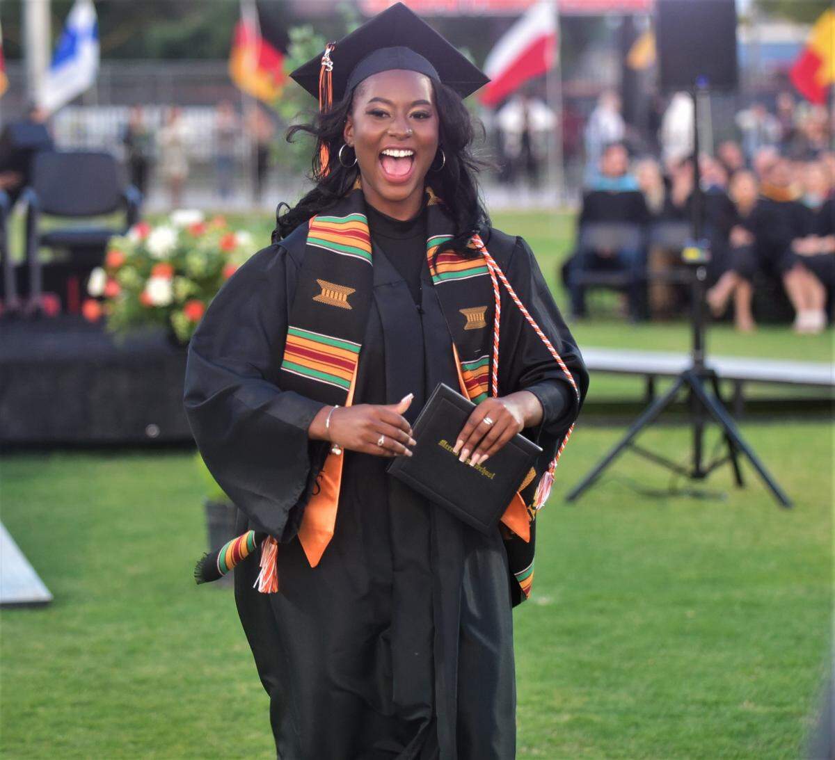 Merced High School graduate Ameya Dickerson reacts after receiving her diploma during the school’s graduation ceremony on Thursday, June 1, 2023.