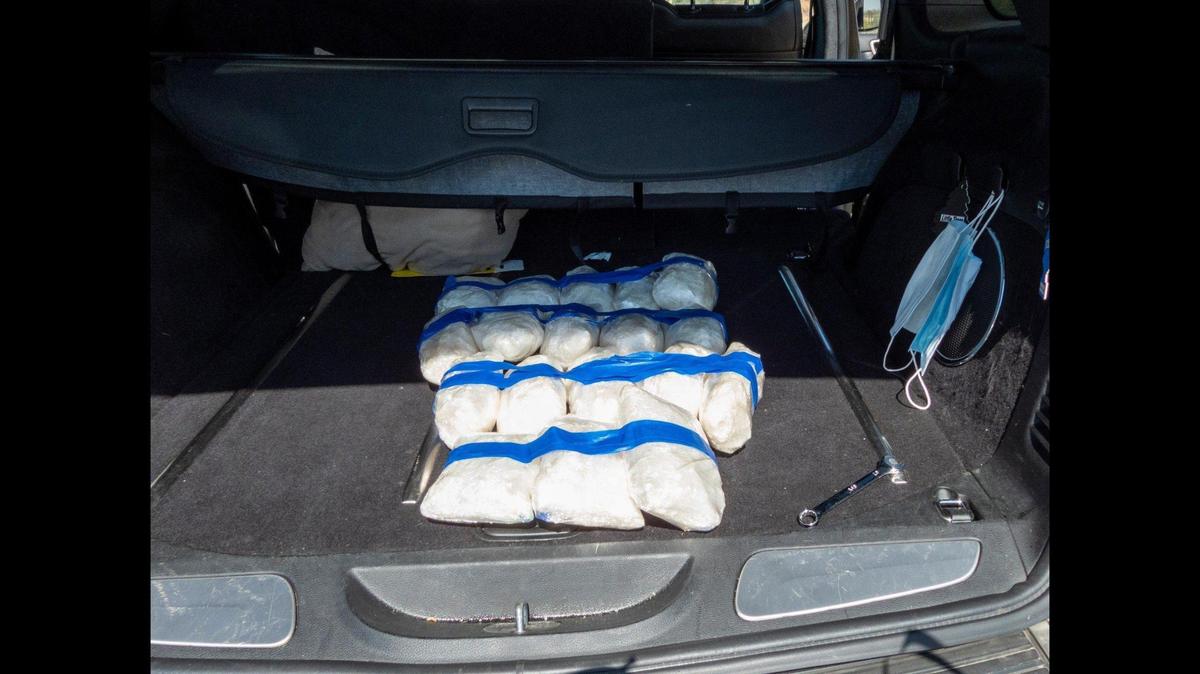 A California Highway Patrol officer and CHP K9 Beny, located about 20 pounds of methamphetamine inside a vehicle during a traffic stop in Fresno County, according to the CHP. Image courtesy of California Highway Patrol.