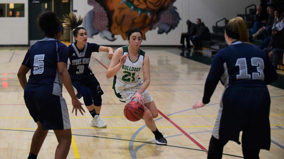 Le Grand High junior Alexa Ulteras (21) dribbles in traffic against Stone Ridge Christian on Friday, Dec. 13, 2019 at Le Grand High. Ultreras scored 16 points to eclipse 1,000 career points.