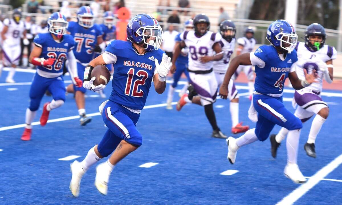 Atwater High senior receiver Landon Perez (12) runs after making a catch during a game against Pacheco on Friday, Aug. 23, 2024 at Dave Honey Stadium in Atwater, Calif.